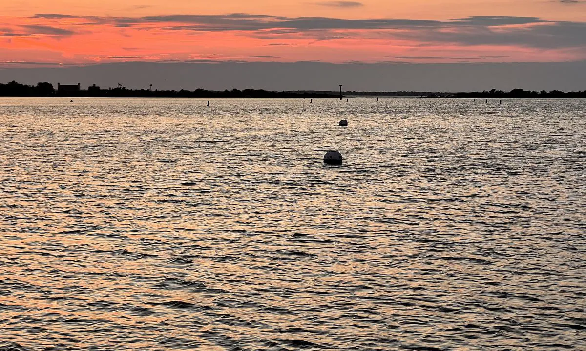 Lake Tashmoo: View from town mooring 10 towards the harbor entrance. The 2 mooring balls in the photo show mooring balls 11 and 12. They are part of the Vineyard Haven harbor and can be booked via Dockwa for $70 per night.